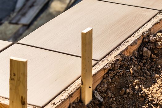 Fresh Pool Coping Cement Drying Within Wood Framing.