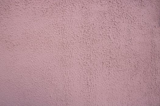 Pink decorative relief . Pink stucco wall. Pink background of the wall.