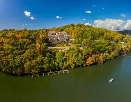 Aerial drone shot of the autumn trees surrounding townhouse development by Cheat Lake in Morgantown, West Virginia