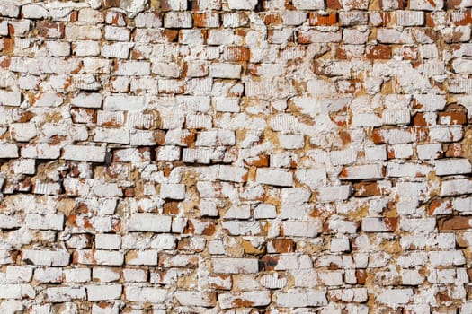old brick wall with white plaster - full frame background and texture.