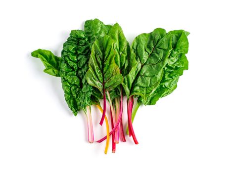 Bunch of swiss chard leafves isolated on white background. Fresh swiss rainbow chard with yellow, red and green colors, top view or flat lay