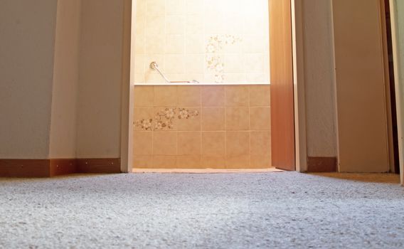 Old bathroom, brown tiled, view from the outside