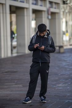 terni,itali october 05 2020:black boy using smartphone