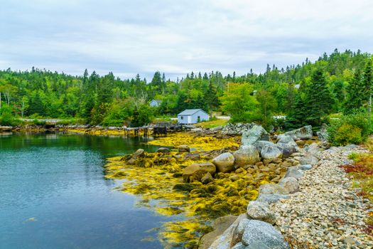 Views of the bay, boats and waterfront buildings in the fishing village Aspotogan, Nova Scotia, Canada