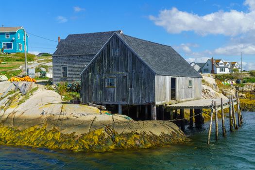 View of boats and houses, in the fishing village Peggys Cove, Nova Scotia, Canada