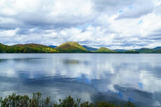 View of Superior Lake, and fall foliage colors in the Laurentian Mountains, Quebec, Canada