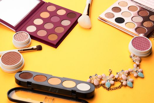 Professional cosmetics palette with eyeshadow makeup brushes cropped look. High quality photo