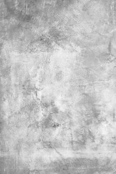 Grungy rough concrete wall. White rough concrete wall. It can be used as textures and backgrounds.