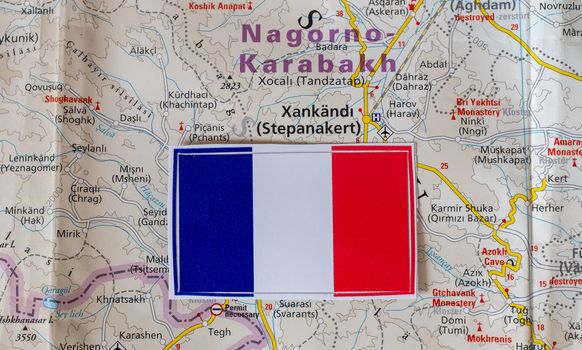 French flag on the background of the map of Nagorno-Karabakh