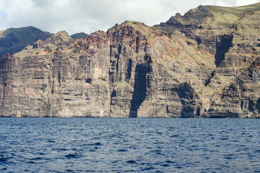 View on the steep coast of Los Gigantes on canary island tenerife with rocks in different colors