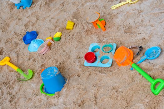 Many colorful sand toy on the sand beach at summer time.