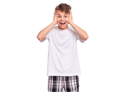 Handsome teen boy laughing looking very happy.