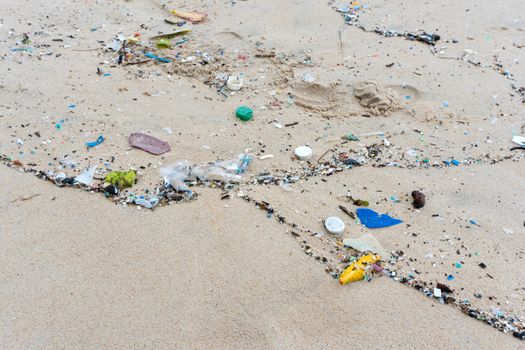 Plastic waste environment pollution on Mai Khao Beach, Phuket, Thailand.