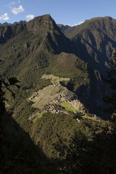 Machu Picchu, Peru - April 6, 2014: View from the top of Machu Picchu, going up to the sacred mountain Huayna Picchu, Peru.