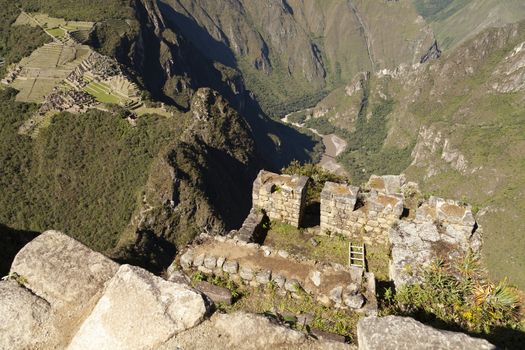 Machu Picchu, Peru - April 6, 2014: View from the top of Machu Picchu, going up to the sacred mountain Huayna Picchu, Peru.