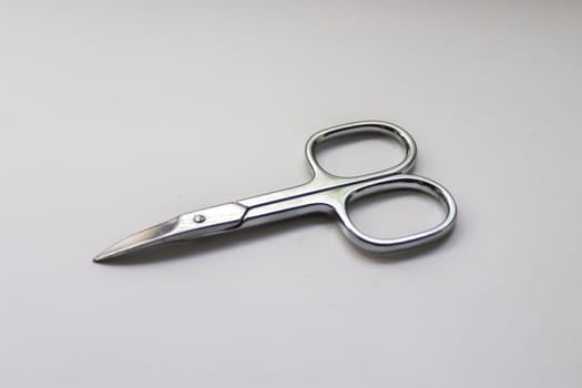 Manicure scissors closeup on white background