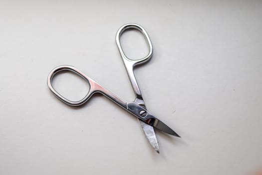 Manicure scissors closeup on white background