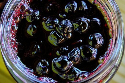 Chokeberry berry jam in a glass jar. Sweet from aronia. Zavidovici, Bosnia and Herzegovina.