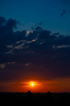 Heavy cloudy sky at sunset. A landscape of beautiful nature.