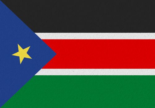 South Sudan paper flag. Patriotic background. National flag of South Sudan