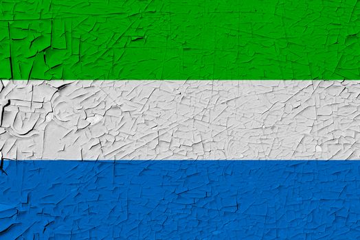 Sierra leone painted flag. Patriotic old grunge background. National flag of Sierra leone