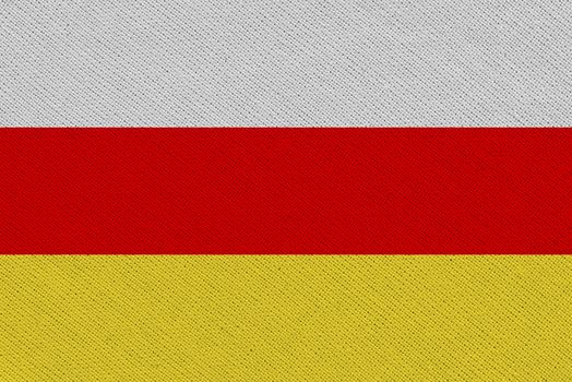 South ossetia fabric flag. Patriotic background. National flag of South ossetia