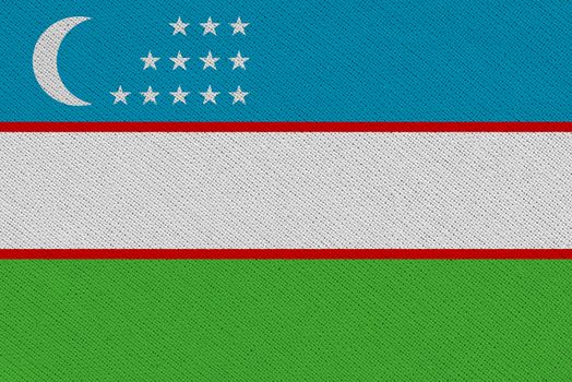 Uzbekistan fabric flag. Patriotic background. National flag of Uzbekistan