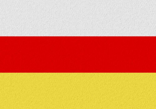 South ossetia paper flag. Patriotic background. National flag of South ossetia