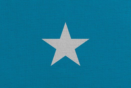 Somalia fabric flag. Patriotic background. National flag of Somalia