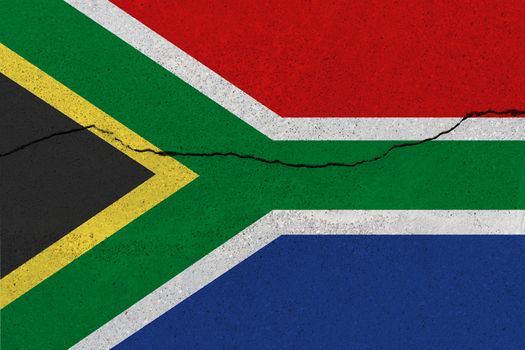 South Africa flag on concrete wall with crack. Patriotic grunge background. National flag of South Africa