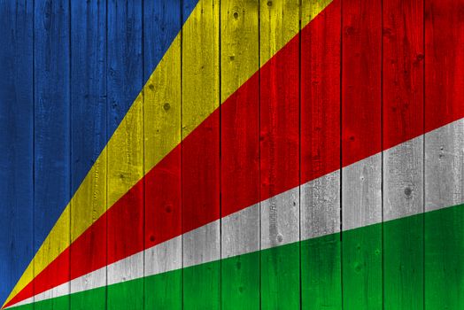 Seychelles flag painted on old wood plank. Patriotic background. National flag of Seychelles