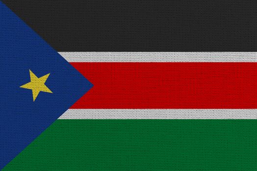 South Sudan fabric flag. Patriotic background. National flag of South Sudan