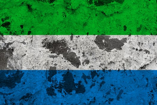 Sierra leone flag on old wall. Patriotic grunge background. National flag of Sierra leone