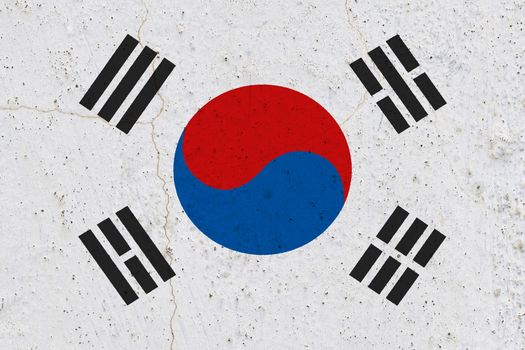 South korea flag on concrete wall. Patriotic grunge background. National flag of South korea