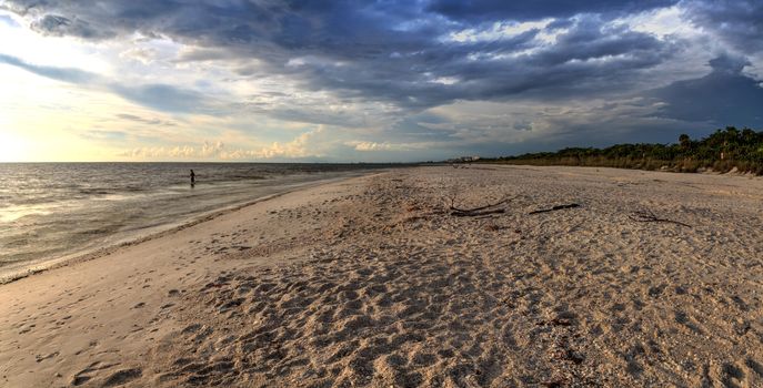 Dark sky over the waters off Barefoot Beach in Bonita Springs, Florida