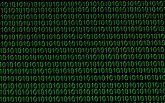 Green computer language binary numbers glow on black background.