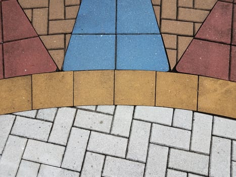 white and red and orange and blue stone tiles on the ground