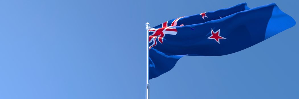 3D rendering of the national flag of New Zealand waving in the wind against a blue sky