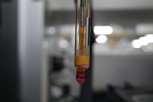 Close-up view of pH meter, a device for measuring pH with equipment for analysis of solutions quality in a chemical laboratory