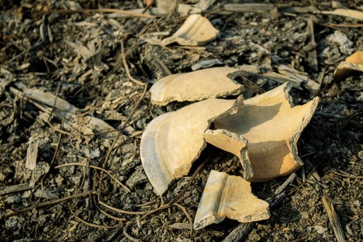 Old pottery and cracked on the floor.