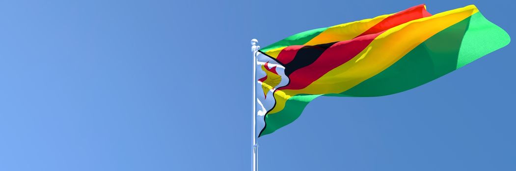 3D rendering of the national flag of Zimbabwe waving in the wind against a blue sky