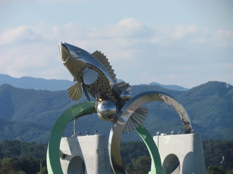 Chuncheon, South Korea- 19th Sep, 2020: The Statue of fish in middle of Soyanggang or soyang river with blue sky