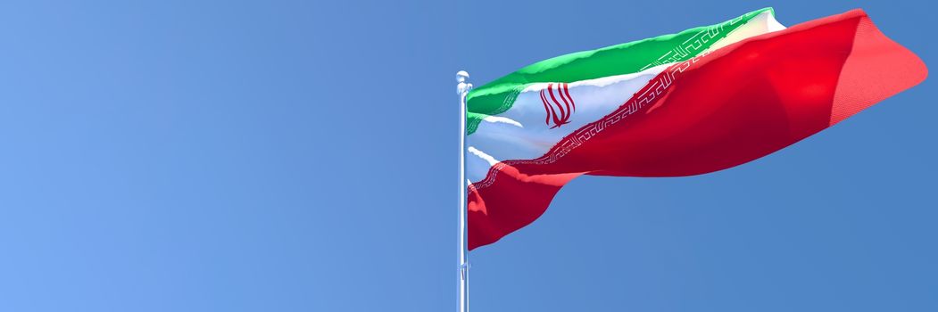 3D rendering of the national flag of Iran waving in the wind against a blue sky