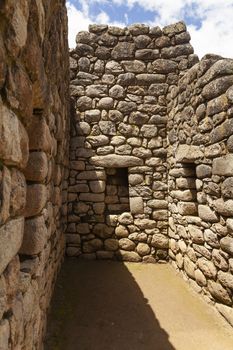 Machu Picchu, Peru - April 6, 2014: Architecture and details of the ancestral constructions and buildings of the Inca civilization, in Machu Picchu, Peru.