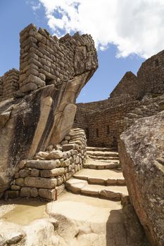 Machu Picchu, Peru - April 6, 2014: Architecture and details of the ancestral constructions and buildings of the Inca civilization, Temple of the Condor in Machu Picchu, Peru.