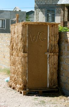 shelter made of straw changing room on the beach.