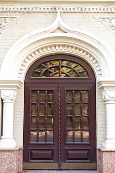 Stylish retro entrance double-leaf door arch.