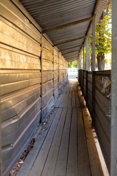 Temporary undercover walkway near the construction site. Safety measures for others.