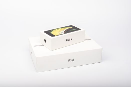 Paris, France - May 14, 2020: packaging of the new black iPhone SE 2020 and iPad from the multinational company Apple during the days of its studio release on a white background