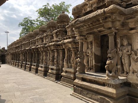 Beautiful view of row of pillars with carvings of sandstone sculpture of Hindu Gods and Lion animals in the ancient temple at Kanchipuram, Tamilnadu